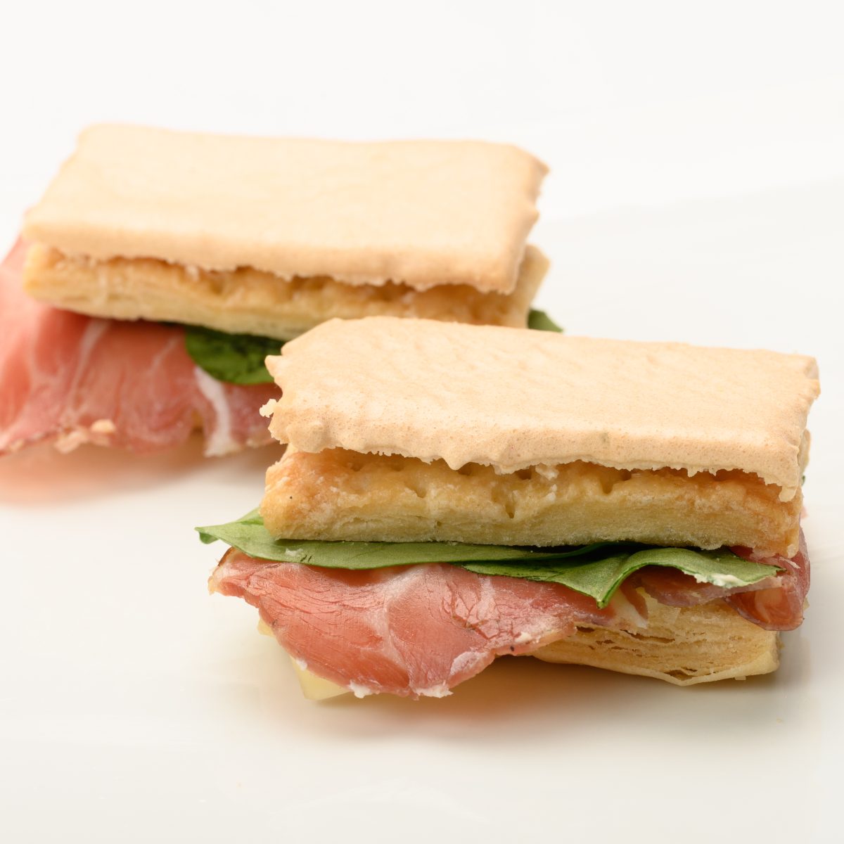 Jesuitas de bondiola, queso y rúcula - 18 unidades